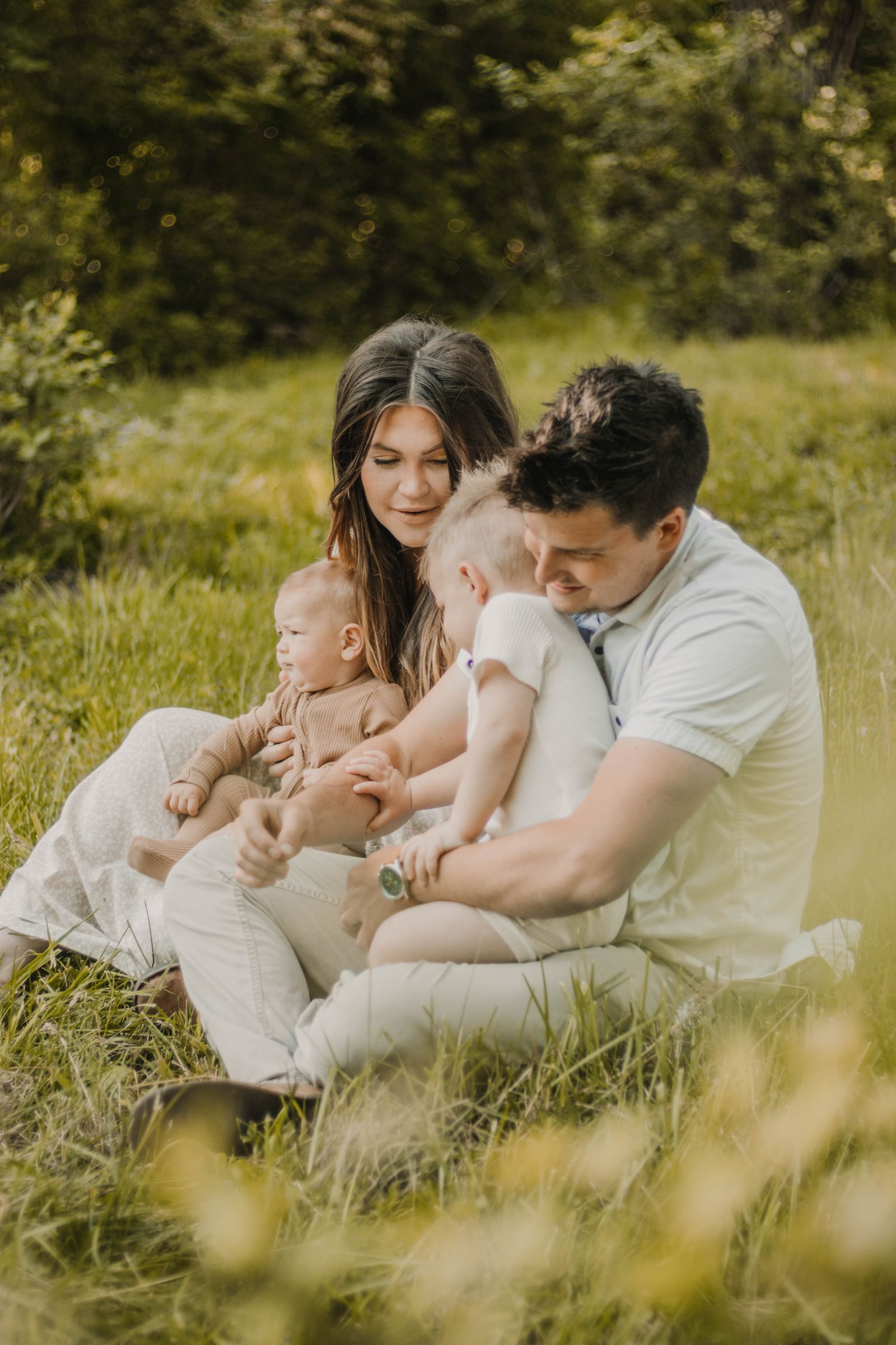Parents and young children sharing a quiet moment outdoors